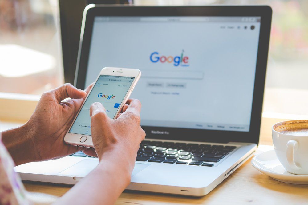 Google+2-2880w Google is opened in a phone and laptop